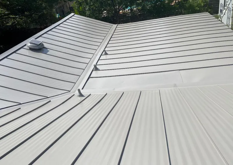Solar attic fan installed on a metal roof for Roof Ventilation in Cleburne